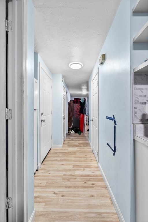 19 Myrtle Avenue Webster, MA 01570 - Photo 25 of 42 a view of a hallway with a white walls