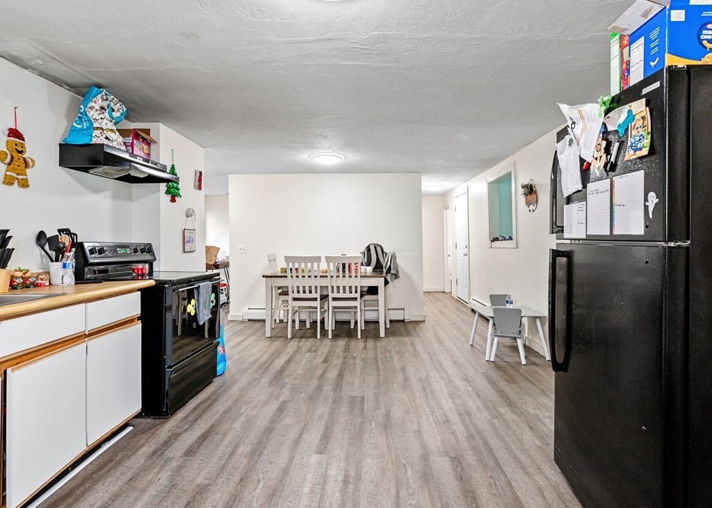 19 Myrtle Avenue Webster, MA 01570 - Photo 4 of 42 a kitchen with stainless steel appliances a refrigerator and a stove top oven