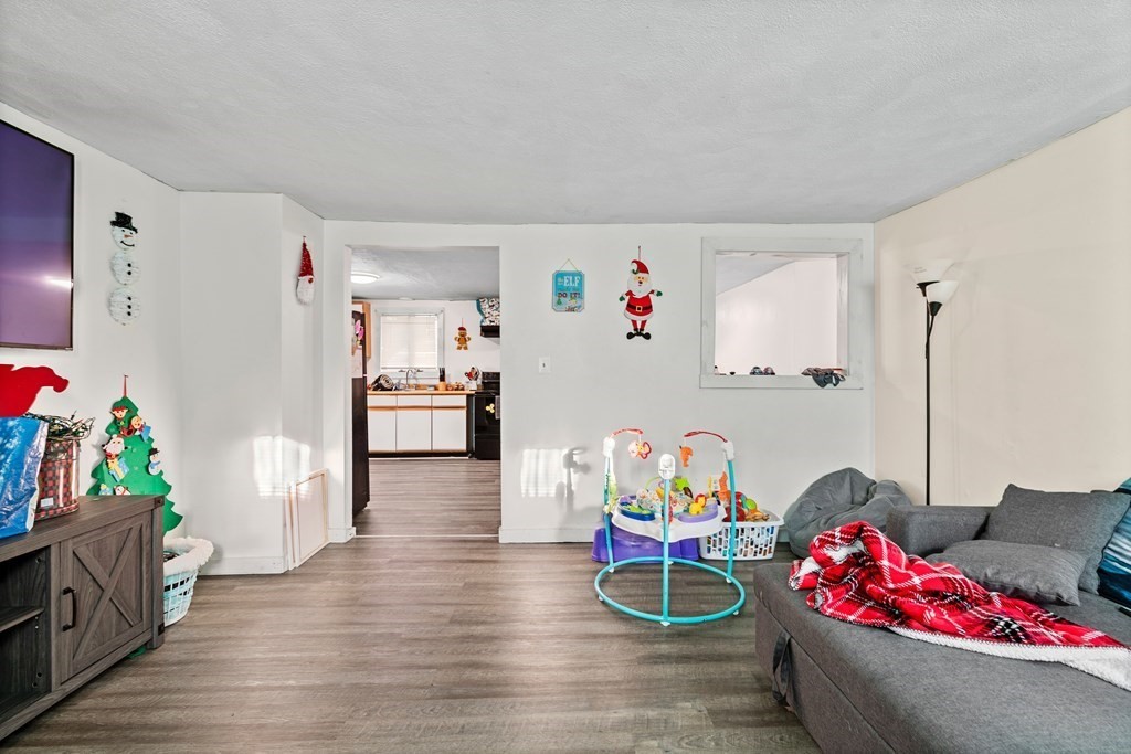 19 Myrtle Avenue Webster, MA 01570 - Photo 6 of 42 a living room with furniture and wooden floor
