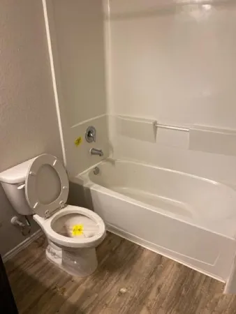 a bathroom with a mirror toilet and sink