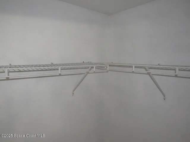 a view of a room with racks on the wall
