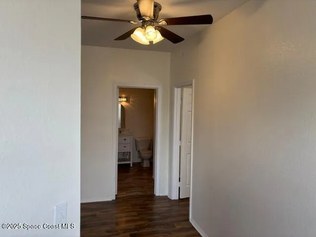 a view of a bedroom from a hallway