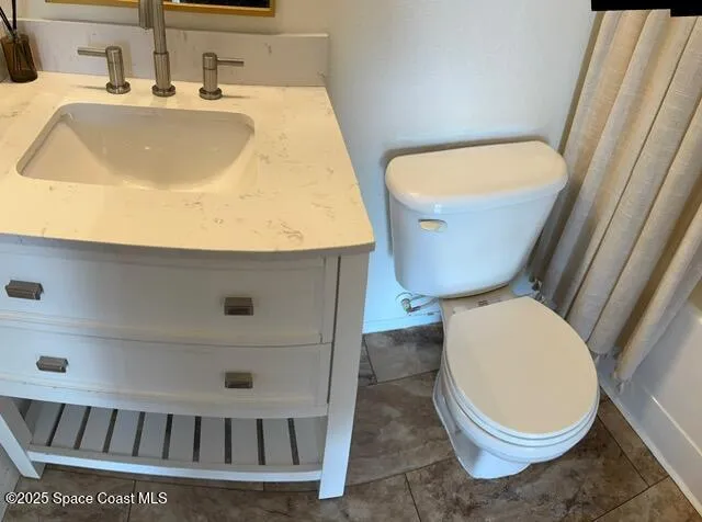 a bathroom with a toilet and a sink