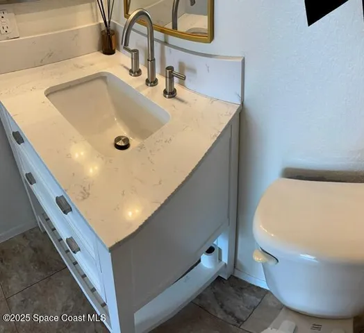 a bathroom with a sink and mirror