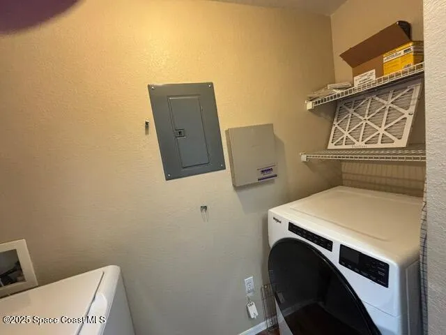 a utility room with dryer and washer