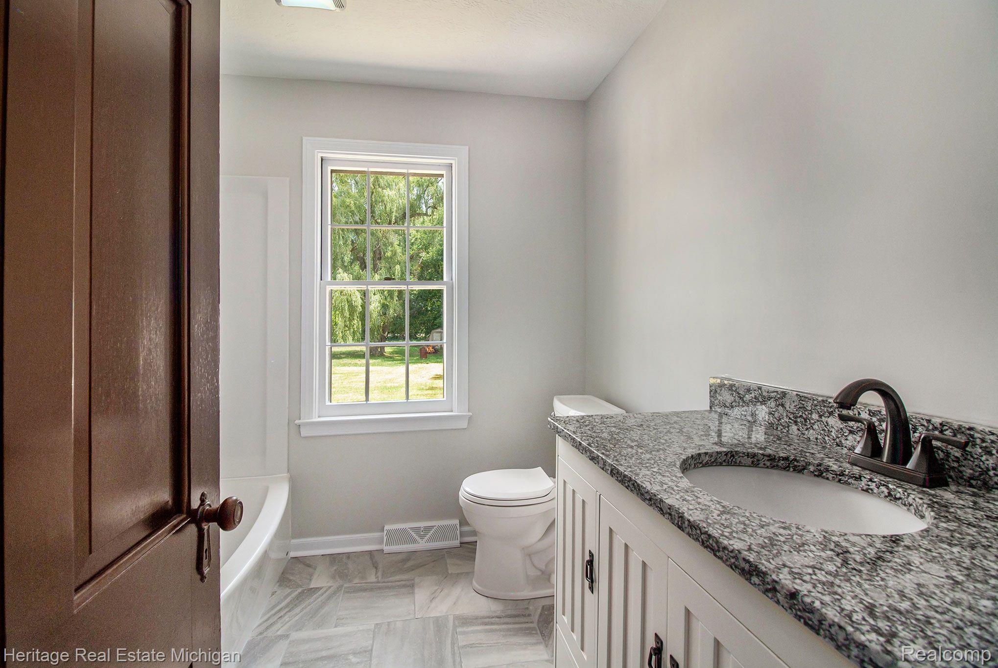 1285 Byron Road Howell, MI 48843 - Photo 12 of 22 The bath is bright and shiny!