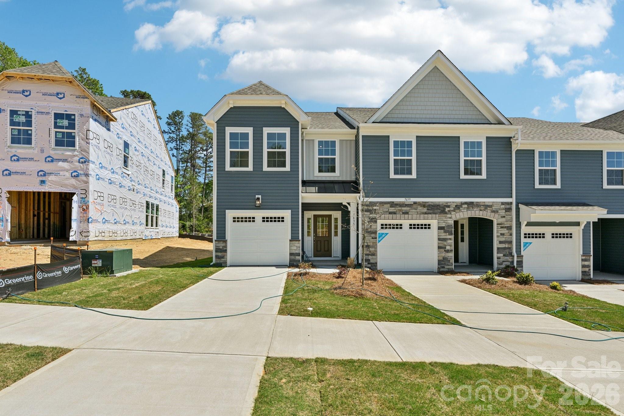 7635 Ethora Way Charlotte, NC 28216 - Photo 1 of 37 a front view of a house with yard and trees
