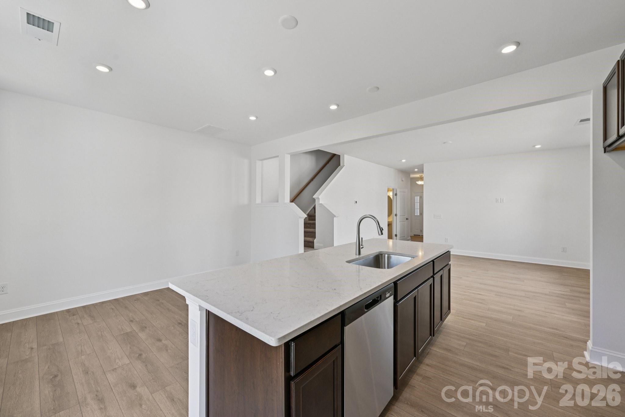 7635 Ethora Way Charlotte, NC 28216 - Photo 15 of 37 a kitchen with stainless steel appliances granite countertop a sink and a refrigerator