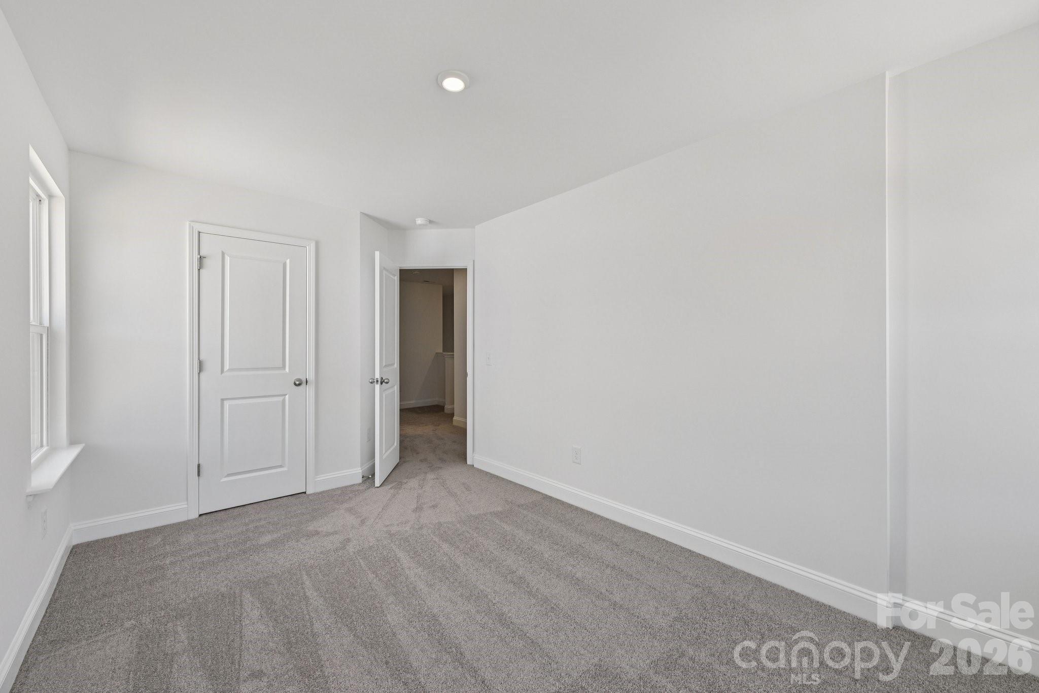 7635 Ethora Way Charlotte, NC 28216 - Photo 21 of 37 a view of an empty room