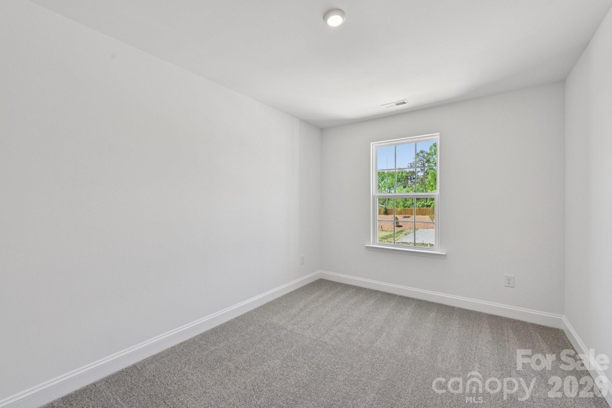 7635 Ethora Way Charlotte, NC 28216 - Photo 22 of 37 an empty room with a window