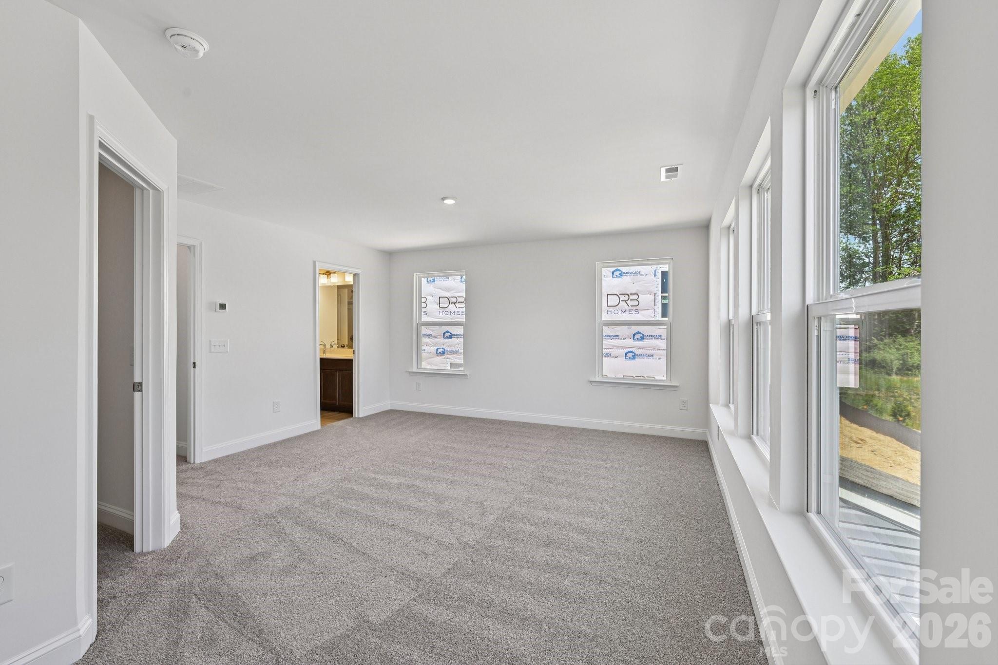 7635 Ethora Way Charlotte, NC 28216 - Photo 25 of 37 a view of an empty room with a window