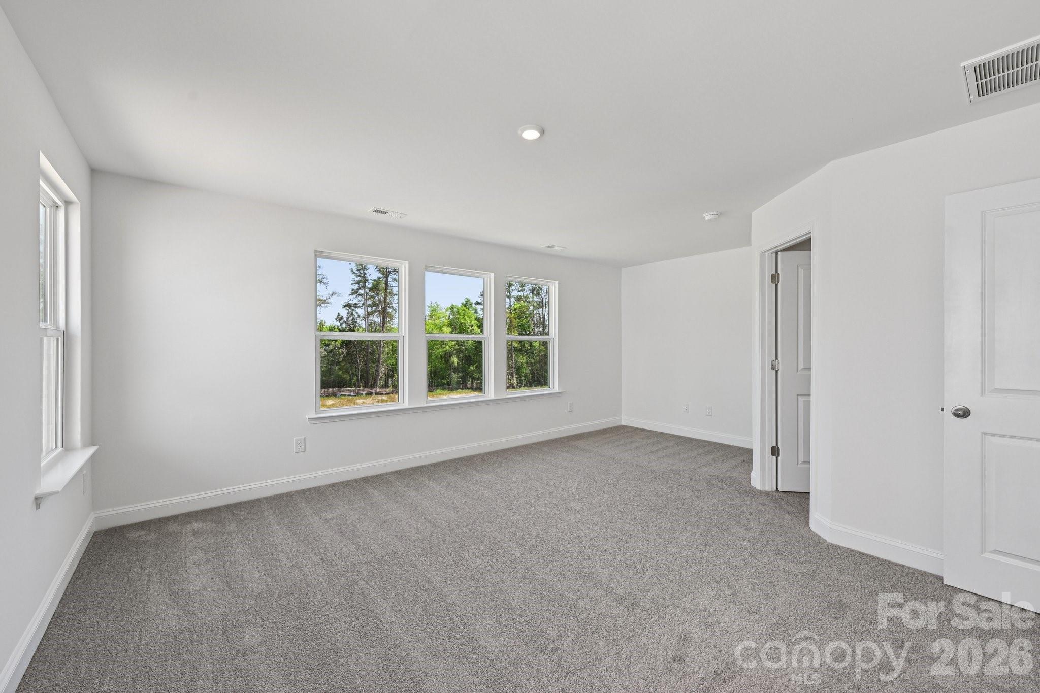 7635 Ethora Way Charlotte, NC 28216 - Photo 27 of 37 an empty room with a window