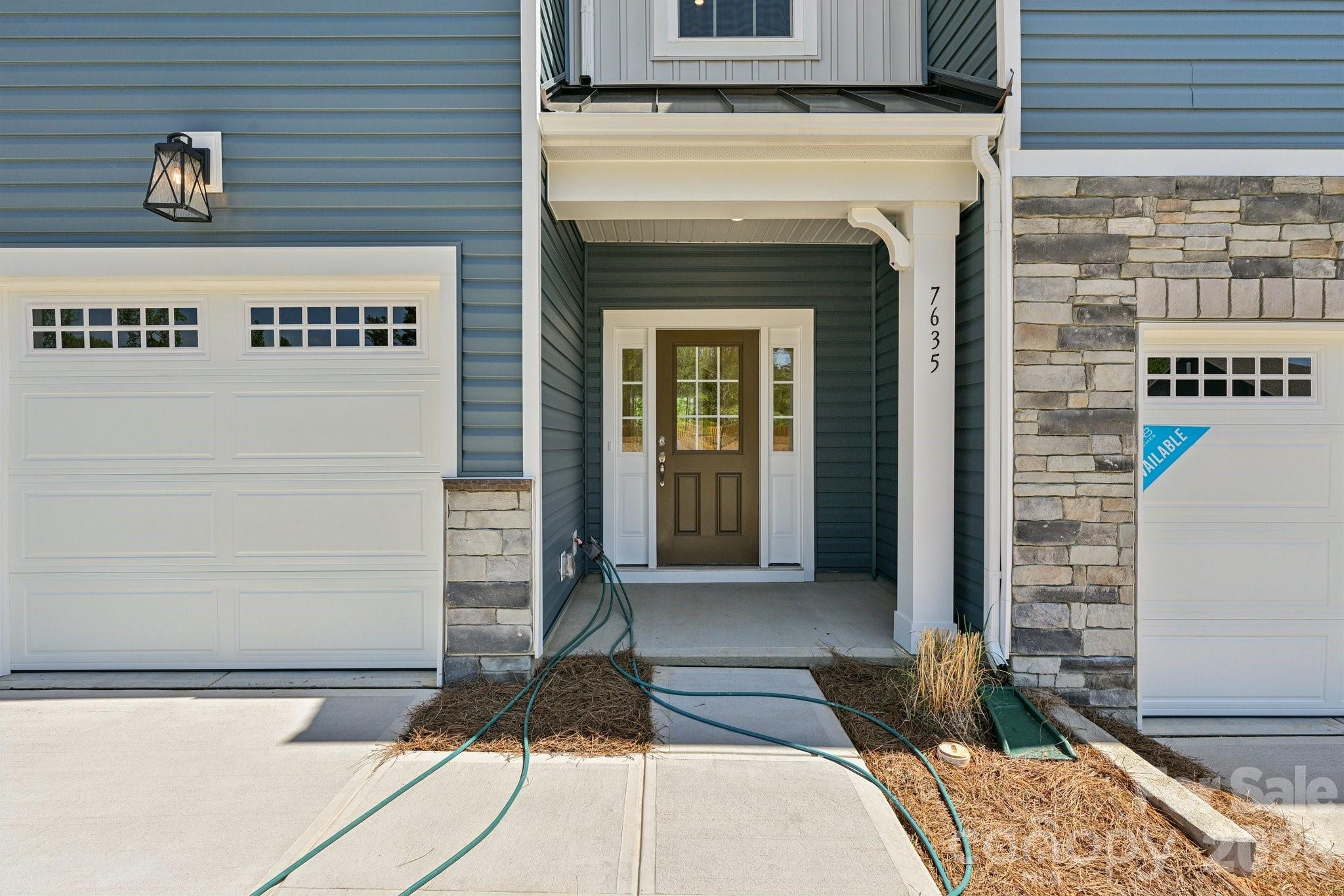 7635 Ethora Way Charlotte, NC 28216 - Photo 3 of 37 a front view of a house with a yard