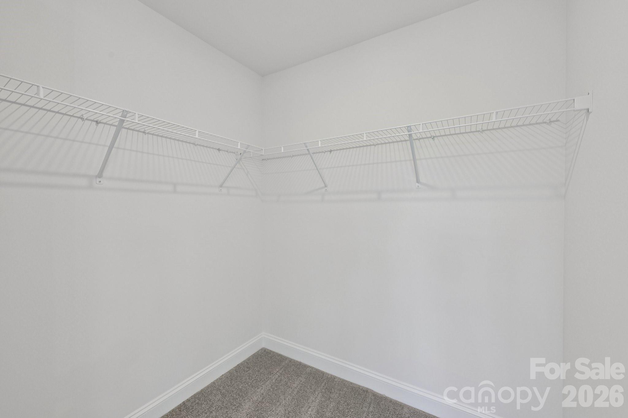 7635 Ethora Way Charlotte, NC 28216 - Photo 32 of 37 a view of a room with racks on the wall