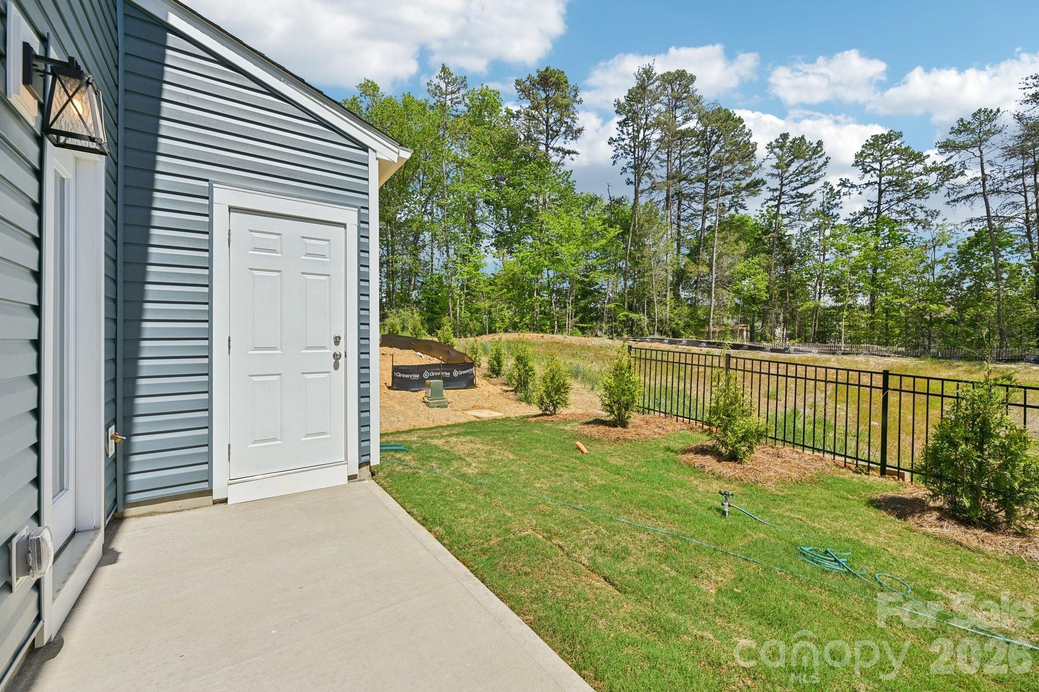 7635 Ethora Way Charlotte, NC 28216 - Photo 33 of 37 a view of a backyard with a garden
