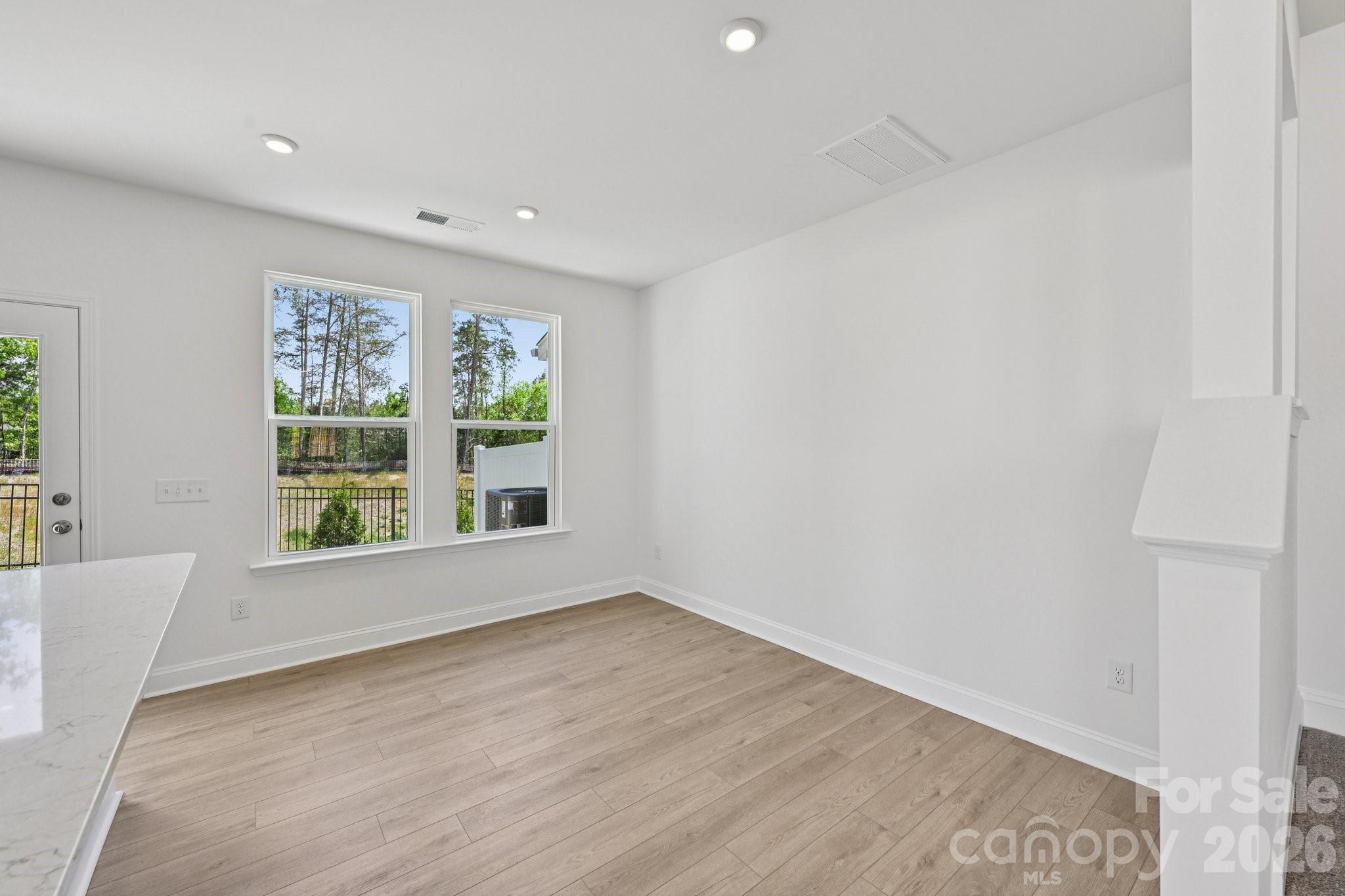 7635 Ethora Way Charlotte, NC 28216 - Photo 10 of 37 a view of an empty room with a window