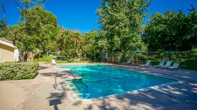 a view of a park with large trees