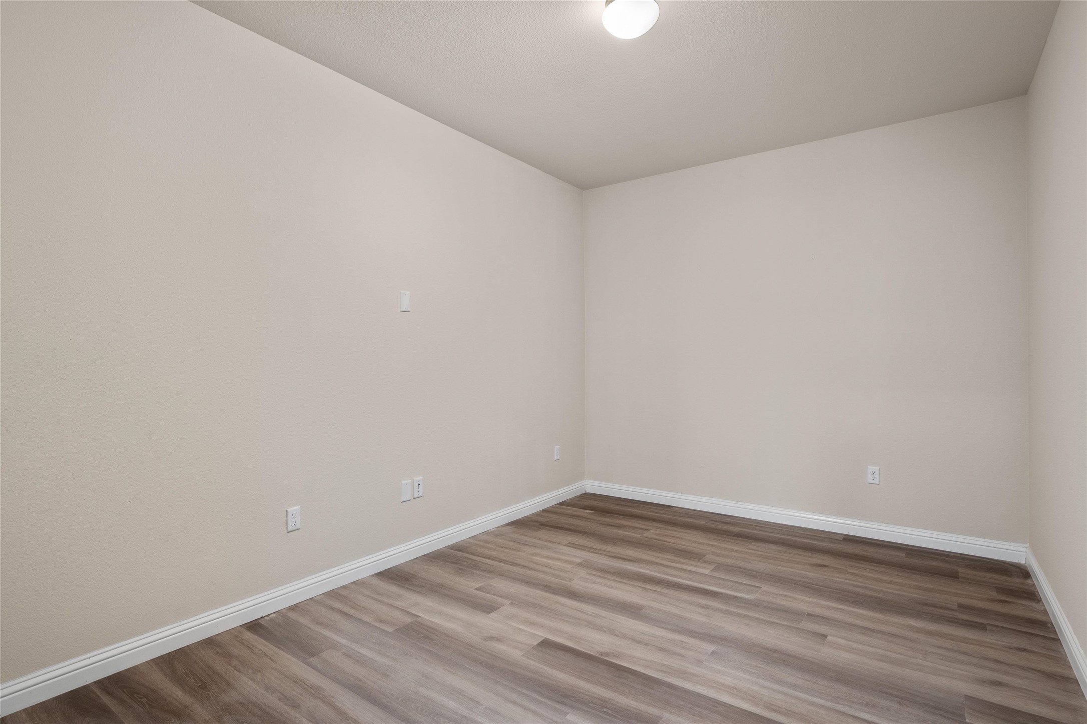 6907 Idea Road Austin, TX 78741 - Photo 22 of 36 a view of an empty room with wooden floor