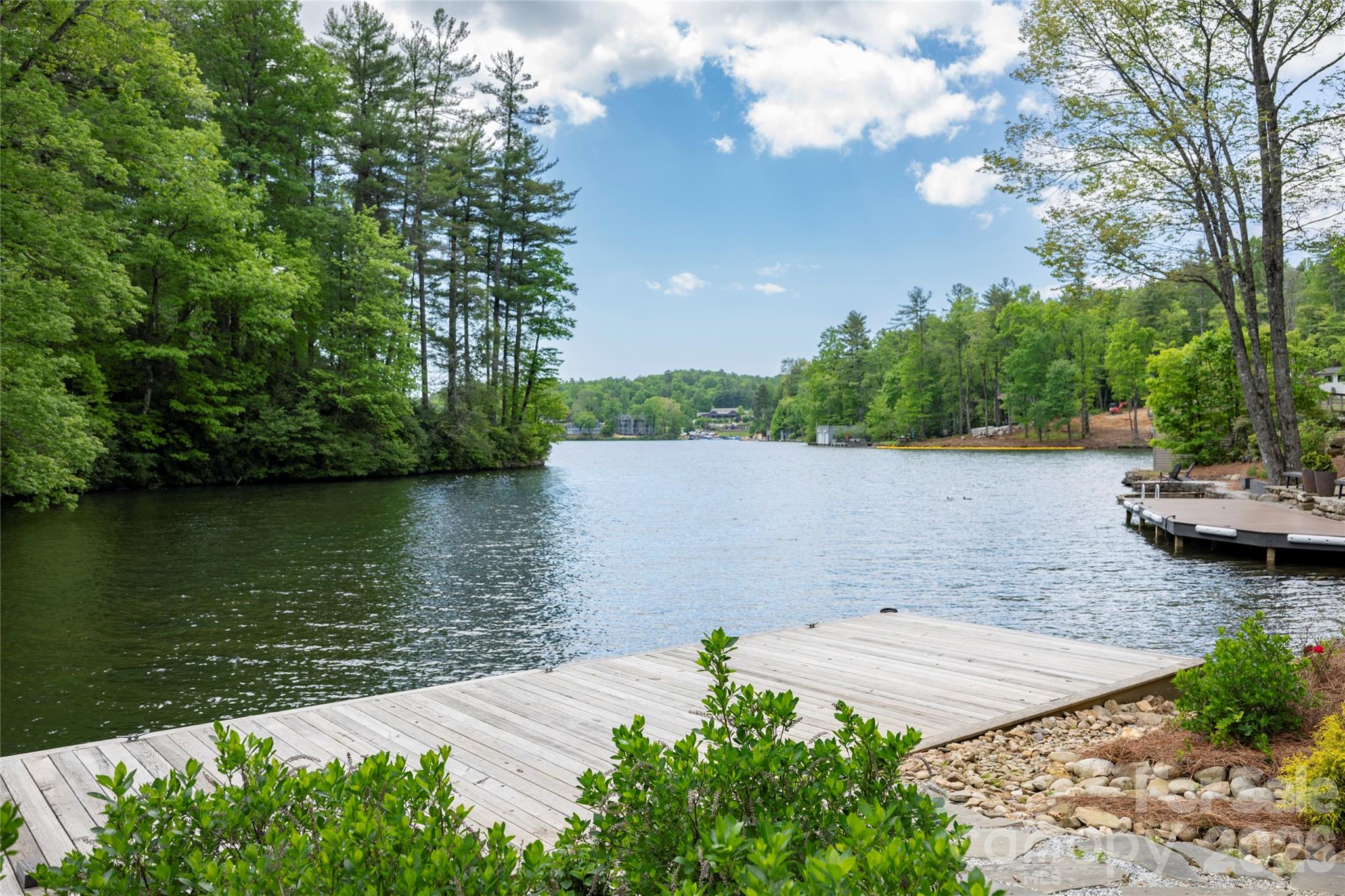 2235 Cold Mountain Road Lake Toxaway, NC 28747 - Photo 38 of 47 a view of a lake with houses in the back