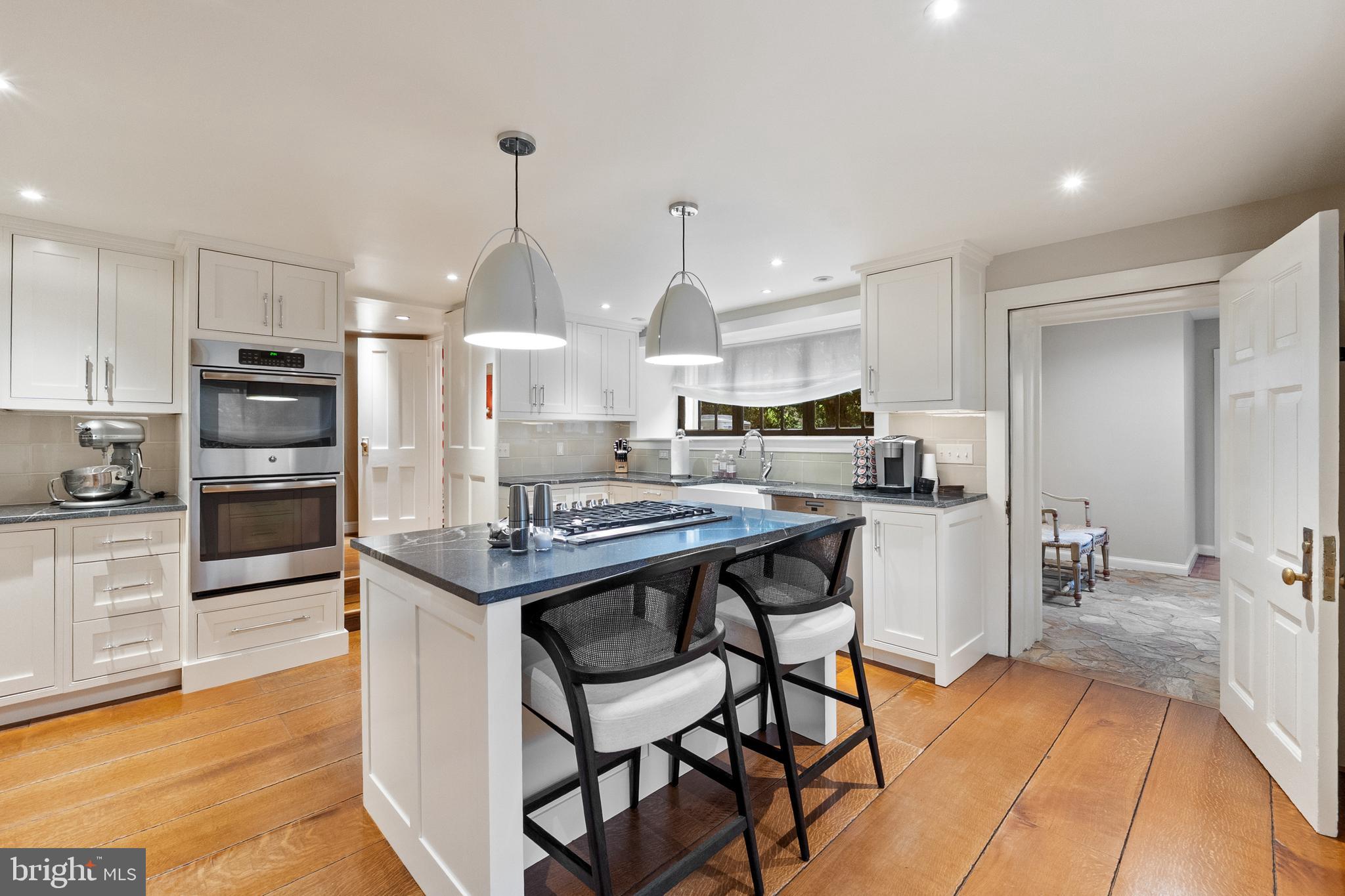 3252 Winchester Road Delaplane, VA 20144 - Photo 36 of 74 a kitchen with stainless steel appliances kitchen island granite countertop a sink and cabinets