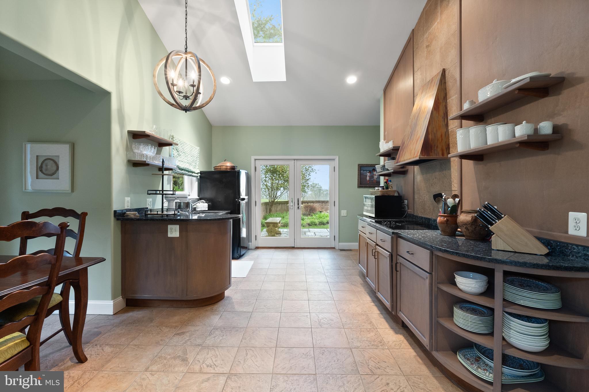 3252 Winchester Road Delaplane, VA 20144 - Photo 56 of 74 a kitchen with stainless steel appliances granite countertop a sink and a stove