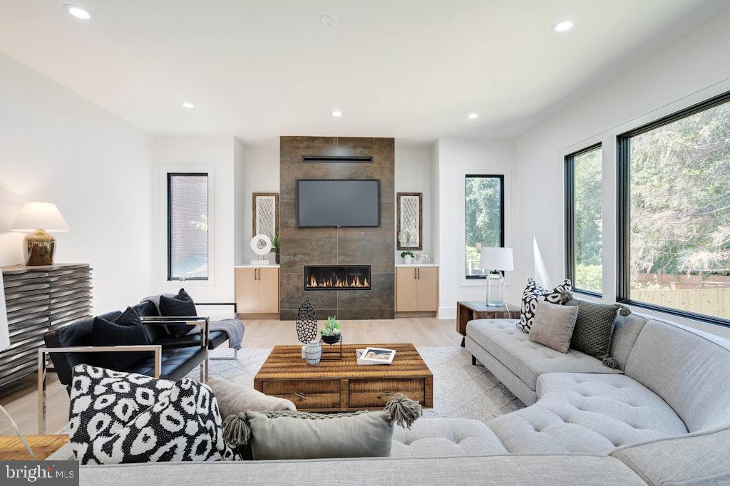 5225 Little Falls Road Arlington, VA 22207 - Photo 12 of 60 a living room with furniture fireplace and a large window