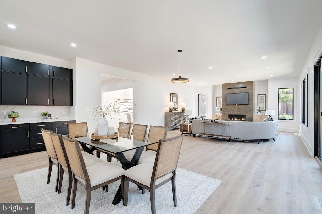 5225 Little Falls Road Arlington, VA 22207 - Photo 17 of 60 a view of a dining room with furniture window and wooden floor