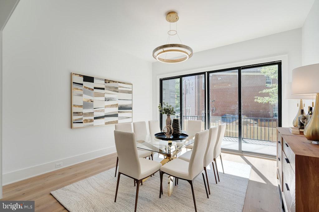 5225 Little Falls Road Arlington, VA 22207 - Photo 24 of 60 a dining room with furniture and wooden floor