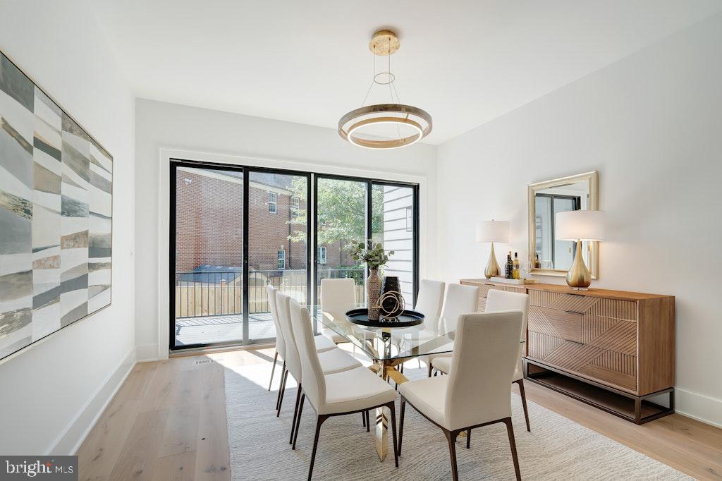 5225 Little Falls Road Arlington, VA 22207 - Photo 25 of 60 a view of a dining room with furniture wooden floor and front door
