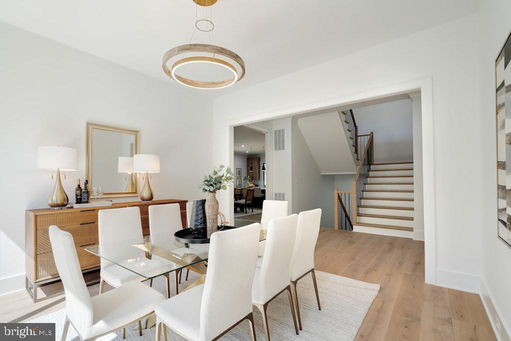 5225 Little Falls Road Arlington, VA 22207 - Photo 26 of 60 a dining room with furniture and wooden floor