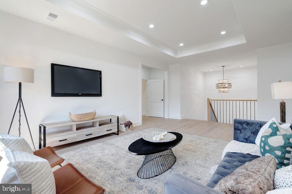 5225 Little Falls Road Arlington, VA 22207 - Photo 28 of 60 a living room with furniture and a flat screen tv