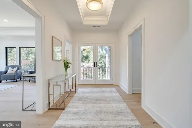 a spacious bedroom with a bed a couch and dresser
