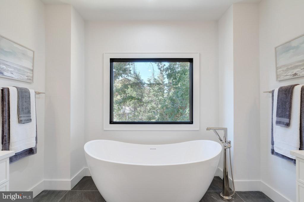 5225 Little Falls Road Arlington, VA 22207 - Photo 35 of 60 a white bath tub sitting in a bathroom