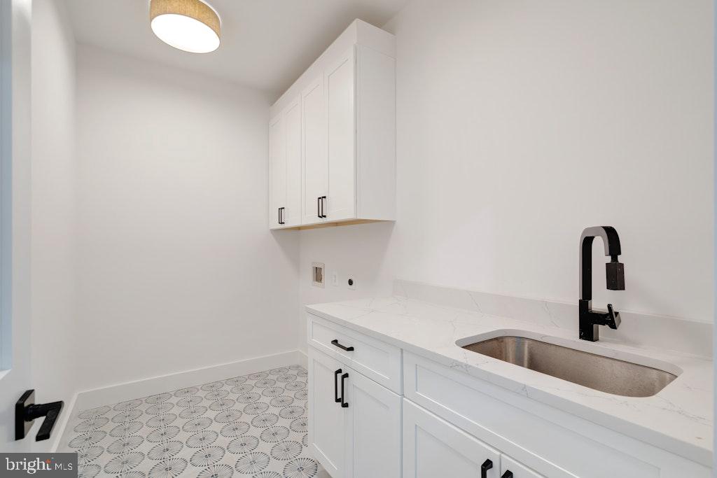 5225 Little Falls Road Arlington, VA 22207 - Photo 38 of 60 a kitchen with cabinets and sink