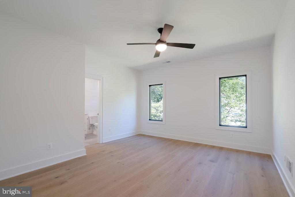 5225 Little Falls Road Arlington, VA 22207 - Photo 45 of 60 a view of empty room with wooden floor and fan