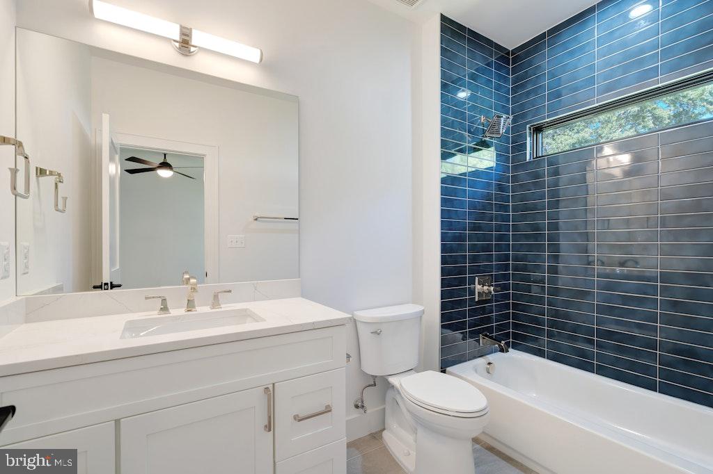 5225 Little Falls Road Arlington, VA 22207 - Photo 46 of 60 a bathroom with a sink a toilet and shower