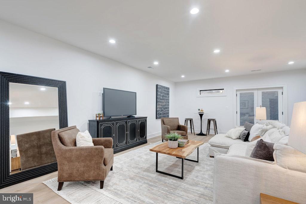 5225 Little Falls Road Arlington, VA 22207 - Photo 47 of 60 a living room with furniture and a flat screen tv