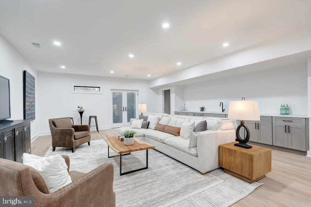 5225 Little Falls Road Arlington, VA 22207 - Photo 48 of 60 a living room with furniture and a flat screen tv