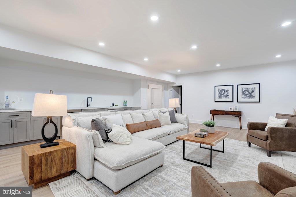 5225 Little Falls Road Arlington, VA 22207 - Photo 50 of 60 a living room with furniture and a lamp