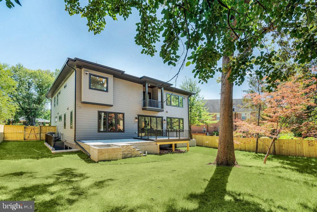 5225 Little Falls Road Arlington, VA 22207 - Photo 57 of 60 a front view of a house with a yard table and chairs
