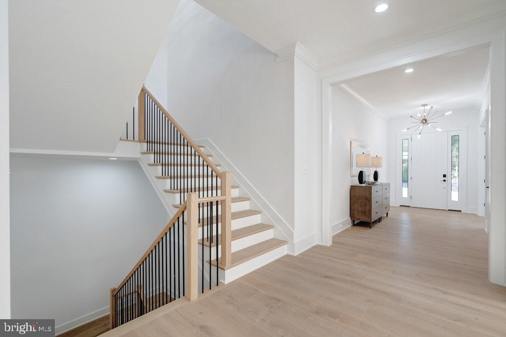 5225 Little Falls Road Arlington, VA 22207 - Photo 6 of 60 a view of a hallway with wooden floor and staircase