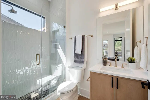 a living room with furniture fireplace and a large window