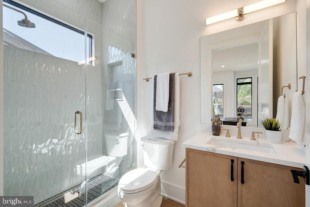 5225 Little Falls Road Arlington, VA 22207 - Photo 10 of 60 a bathroom with a sink a toilet and shower