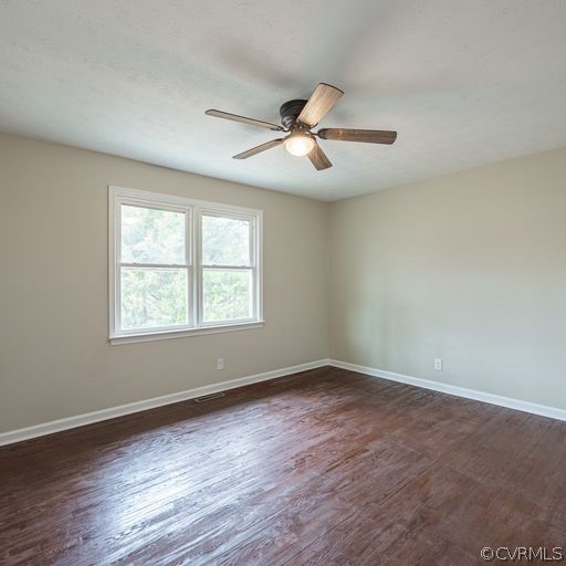 1814 Lockett Road Rice, VA 23966 - Photo 17 of 21 an empty room with wooden floor ceiling fan and windows