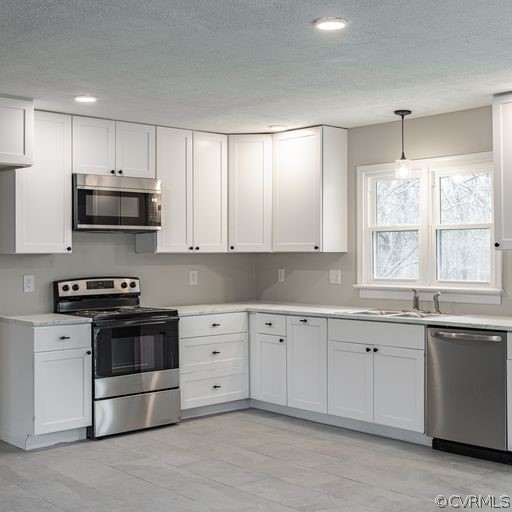 1814 Lockett Road Rice, VA 23966 - Photo 5 of 21 a kitchen with granite countertop white cabinets and stainless steel appliances