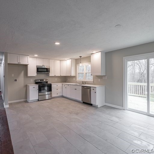 1814 Lockett Road Rice, VA 23966 - Photo 6 of 21 a large kitchen with stainless steel appliances kitchen island granite countertop a stove sink and cabinets