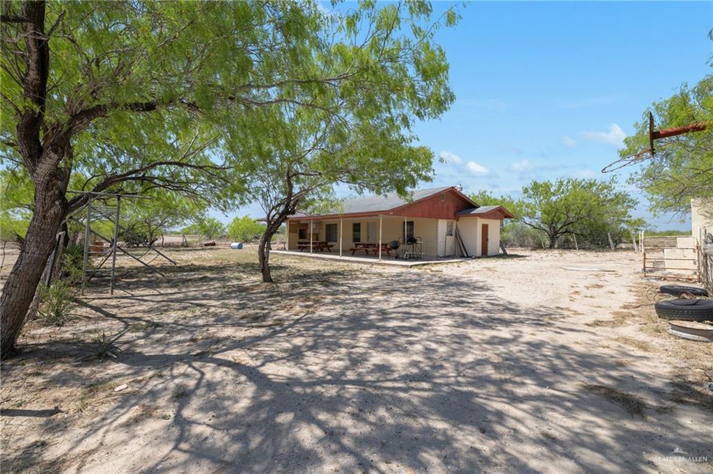 0 65th Roma, TX 78584 - Photo 3 of 15 a front view of a house with a yard