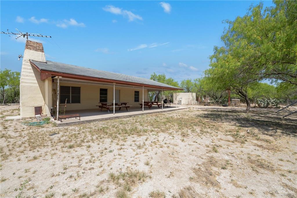 0 65th Roma, TX 78584 - Photo 6 of 15 a front view of a house with a yard