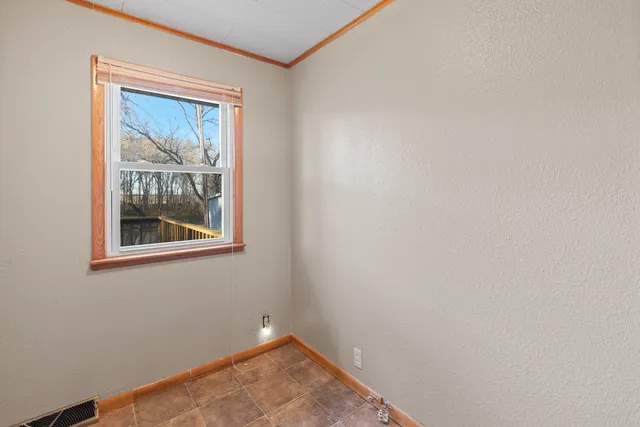 a view of a room with wooden walls