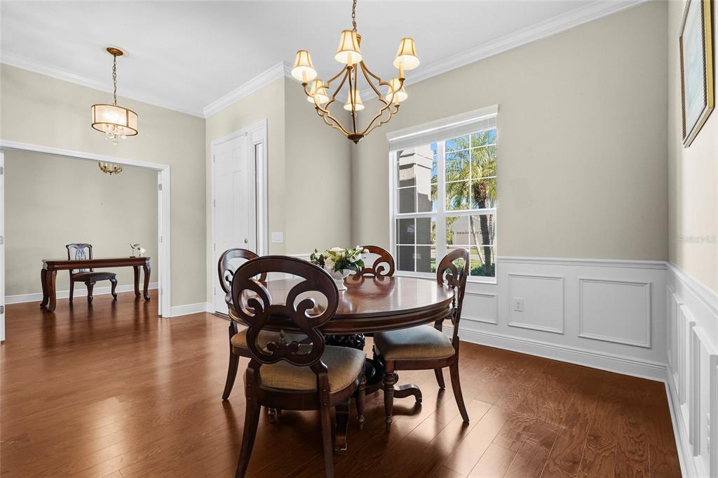 357 Marsh Creek Road Venice, FL 34292 - Photo 21 of 70 a view of a dining room with furniture window and wooden floor